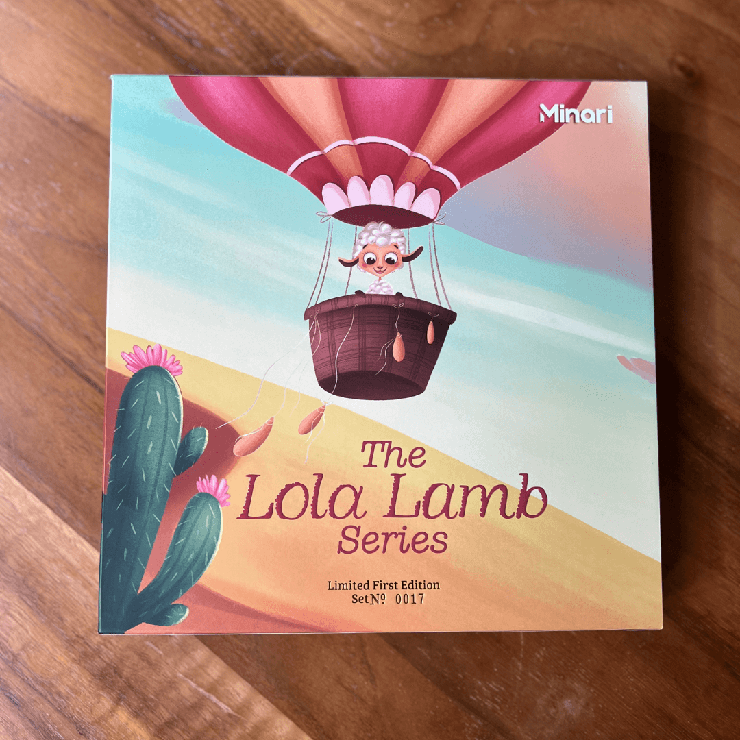 Lola Lamb Gift set front view on a wood background