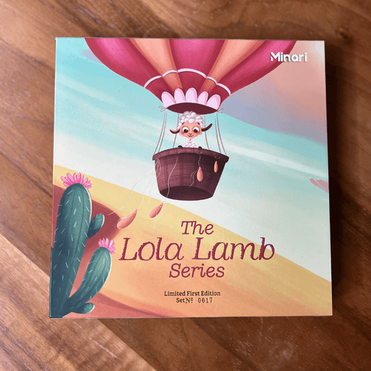 Lola Lamb Gift set front view on a wood background